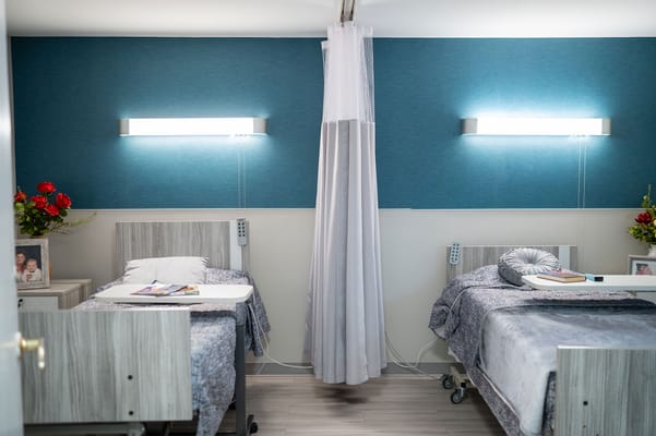 Cozy private resident room with two beds and decor