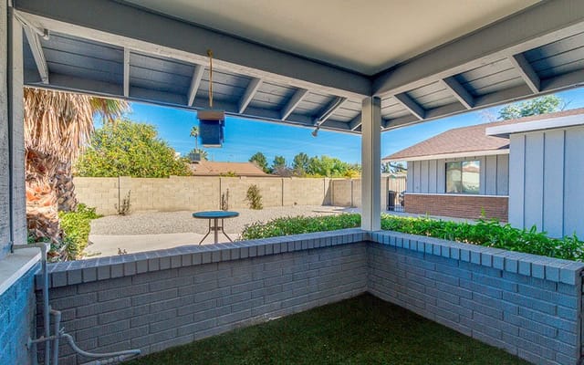 Outdoor patio area with a view of the garden