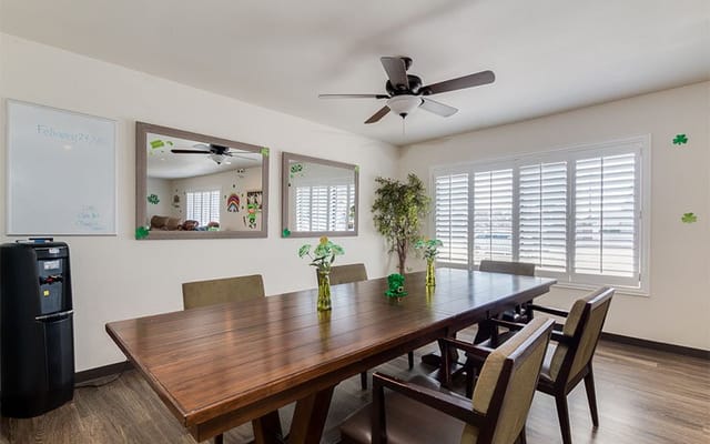 Interior view of a common area with a large table