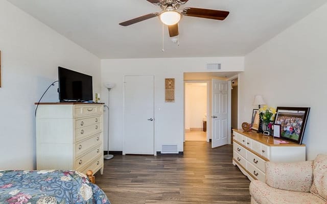 Cozy resident room with furniture and flat-screen TV