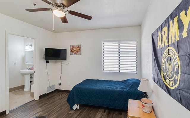 A private resident room featuring an Army flag