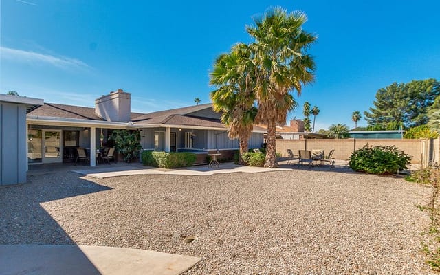 Outdoor patio area with seating and landscaping