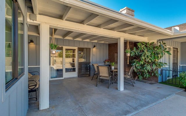 Covered outdoor seating area with plants