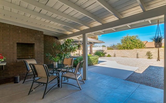 Outdoor seating area with a view of greenery