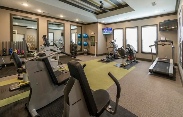 Modern fitness room with exercise equipment