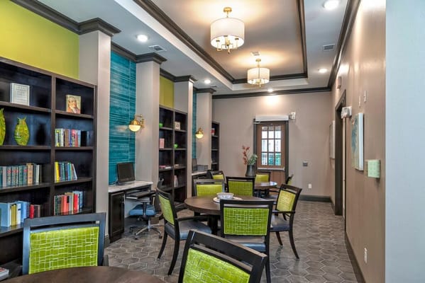 Interior view of a cozy common area with bookshelves
