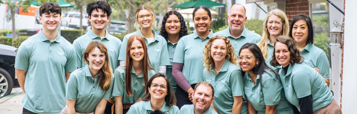 Group photo of staff members in matching shirts