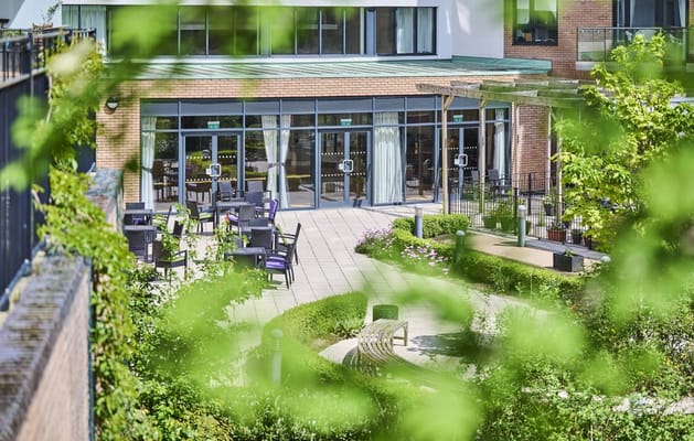 Outdoor patio with seating area and garden