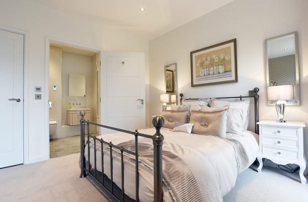 Well-decorated bedroom interior with en-suite bathroom