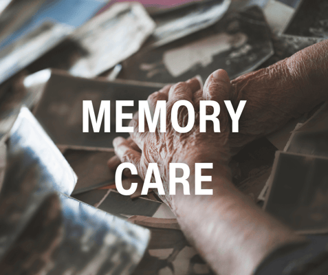 Hands holding photographs related to memory care