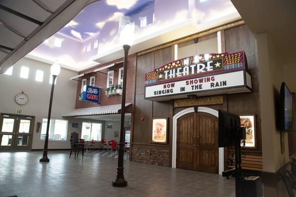 Interior view of a theater with a movie marquee