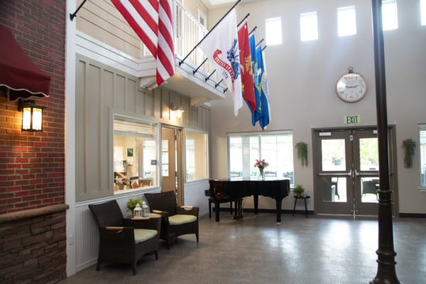 Interior common area with seating and flags
