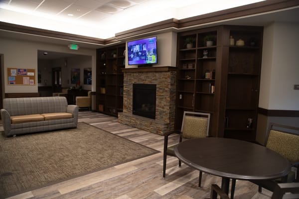 Common area with seating and a fireplace