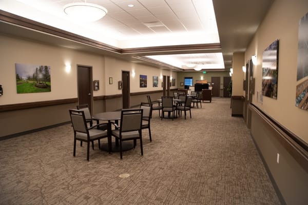 Interior view of a bright common area with chairs