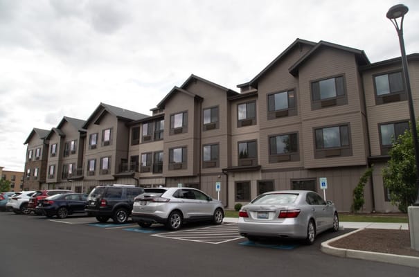 Exterior view of the facility building with parking lot