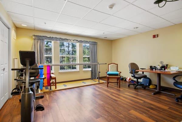 Interior view of a physical therapy room with equipment