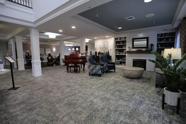 Welcoming common area featuring seating and a piano