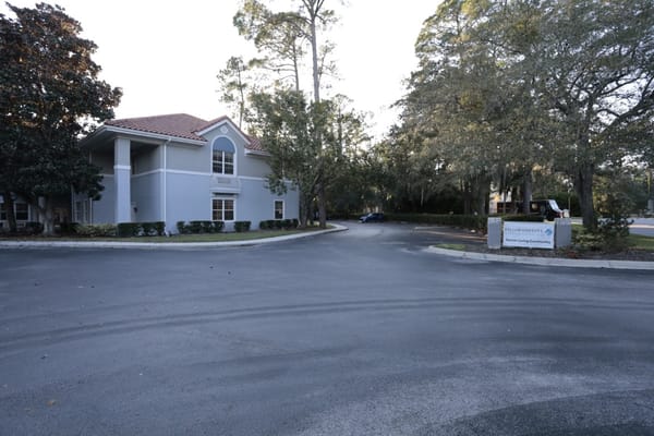 Exterior view of the entrance at The Cove at Marsh Landing senior living facility.
