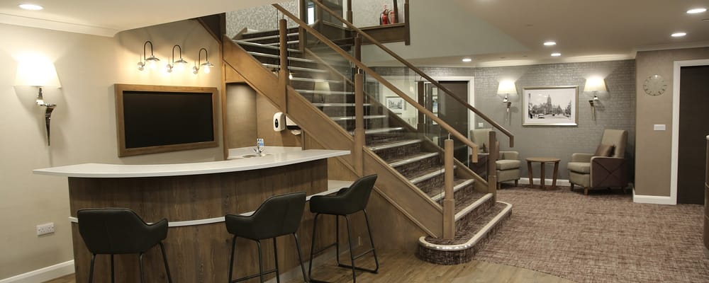 Interior lounge area with seating and staircase