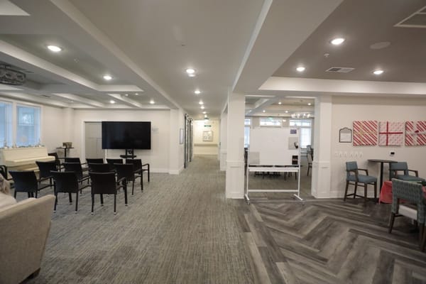 Interior view of a common area with seating and TV