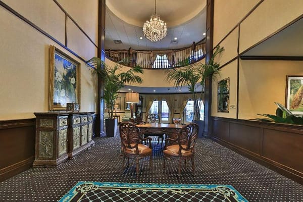 Elegant interior lobby with a chandelier and seating area