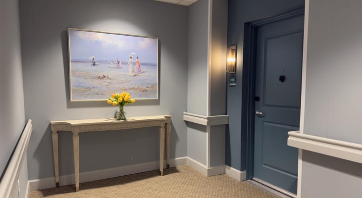 Interior hallway with painting and flower vase