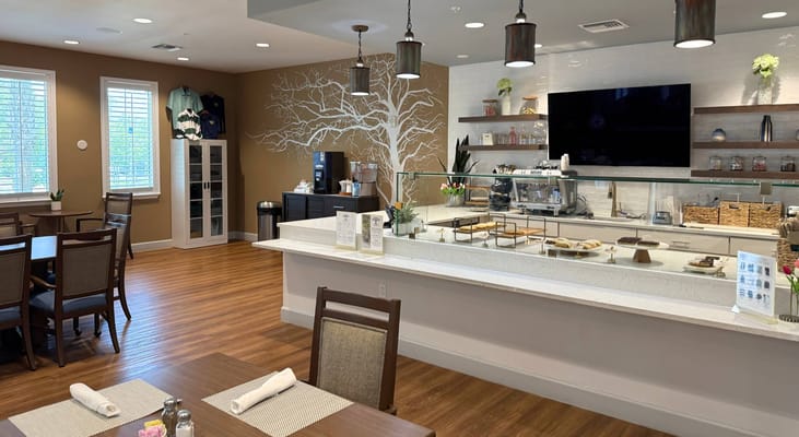 Bright dining area with a clean countertop and seating