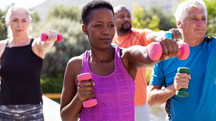Residents participating in an outdoor exercise class