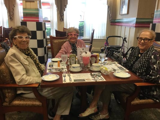 Residents enjoying a meal in the dining room