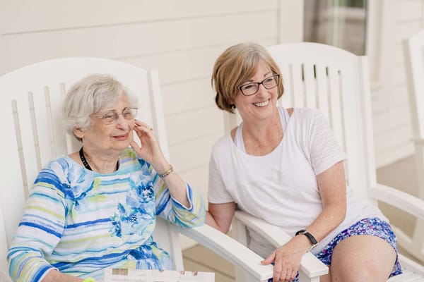 Two women enjoying time together in a common area