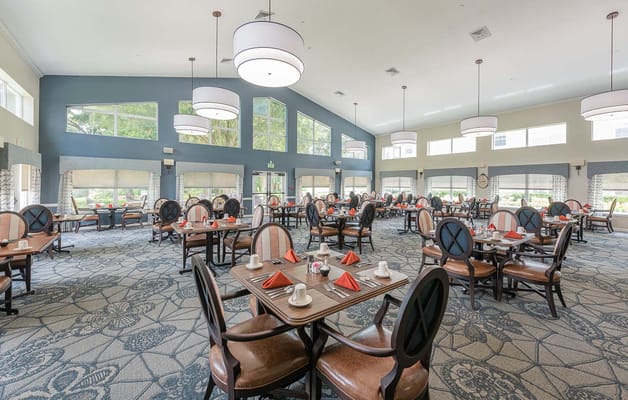 Bright dining room setup with tables and chairs