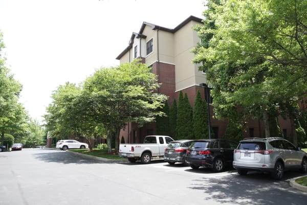 Exterior view of the facility surrounded by trees