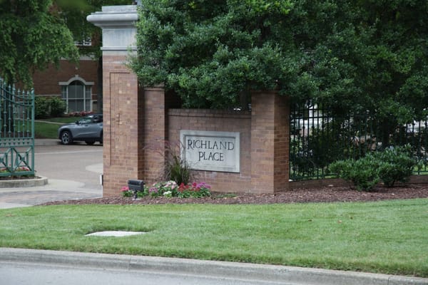 Entrance sign for Richland Place with landscaping