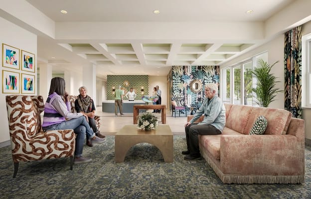 Residents and staff interacting in a vibrant common area