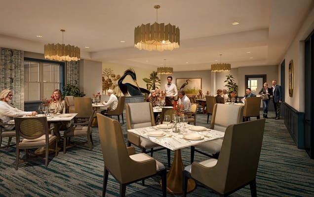Dining area with residents and staff enjoying a meal together