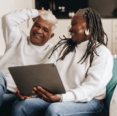 Couple enjoying technology together in a cozy setting