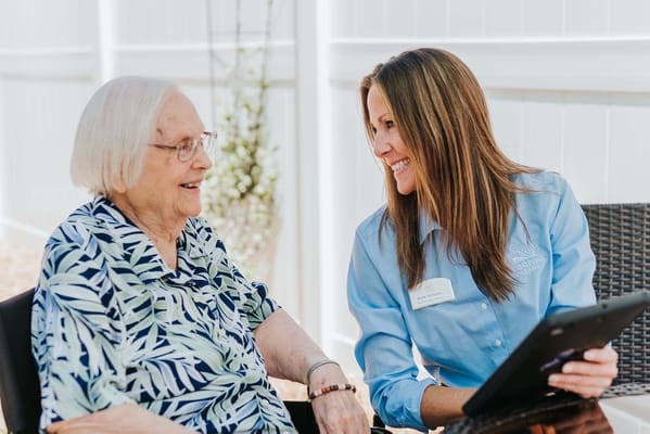 Caregiver interacting with a resident outdoors