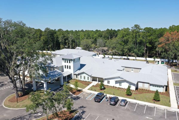 Aerial view of the facility surrounded by trees