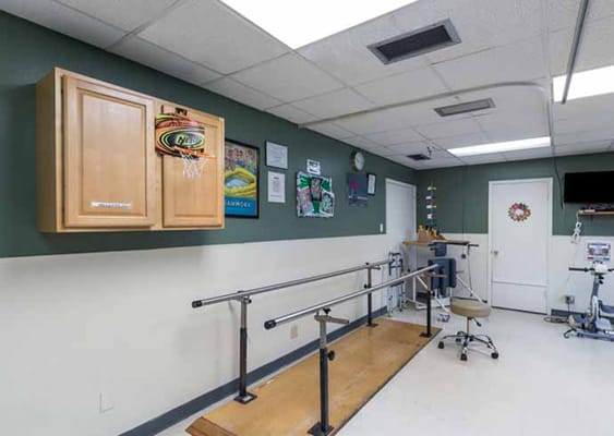 Rehabilitation area with parallel bars for therapy