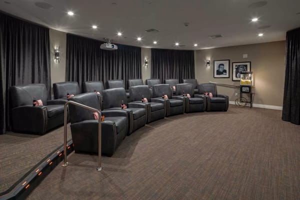 Interior view of a small theater with reclining seats