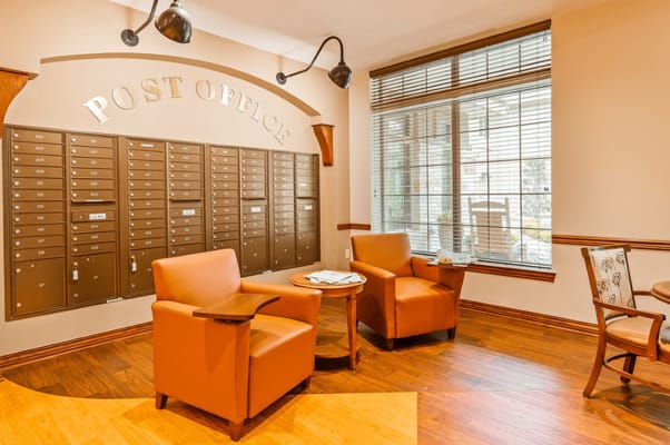 Cozy seating area in the post office section with mailboxes.