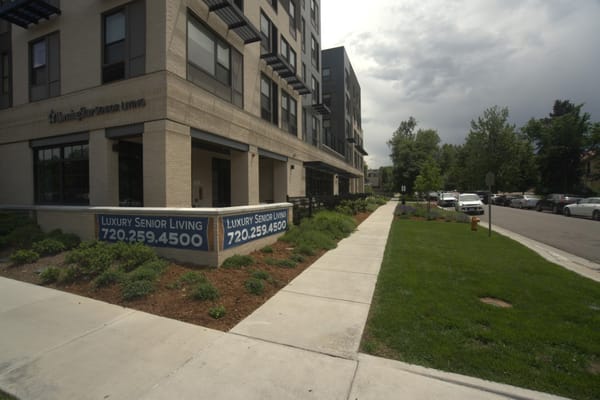Exterior view of the senior living facility with landscaping