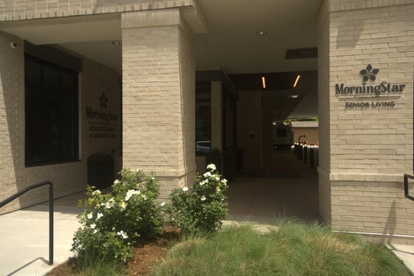 Entrance of MorningStar Assisted Living with flowers