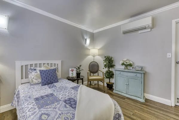 Comfortable private room with bed and chair