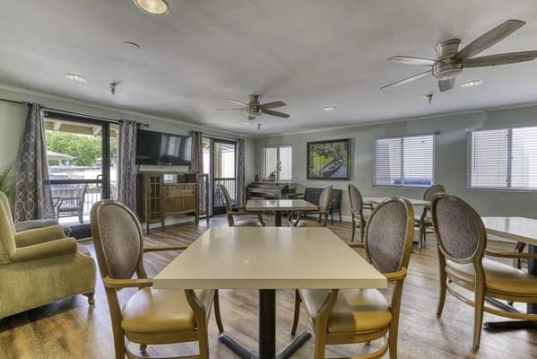 Bright common area with seating and windows