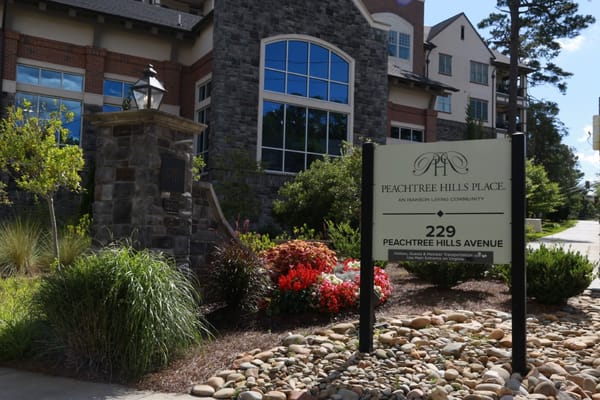 Exterior view of Peachtree Hills Place with signage