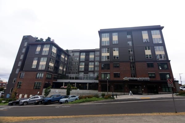 Front exterior view of Merrill Gardens at Wright Park senior living community