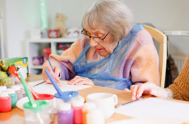Resident engaging in a creative activity