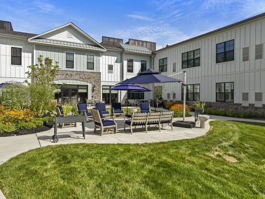 Outdoor patio area with seating and flowers