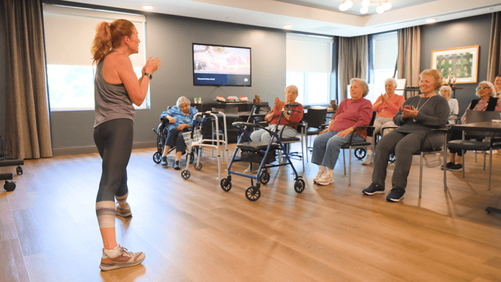 Residents enjoying a fitness class in a common area